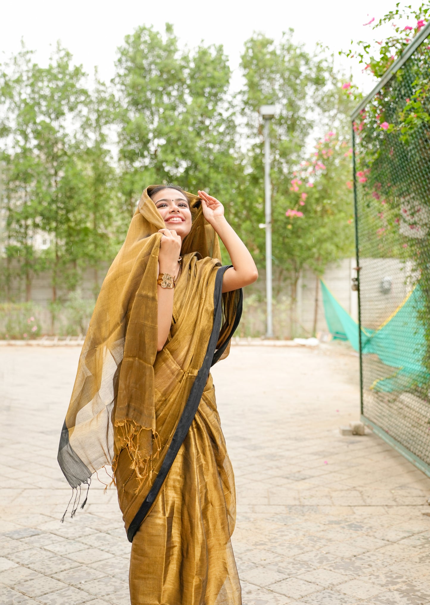 Molten Majesty – Antique Gold Tissue Silk Saree