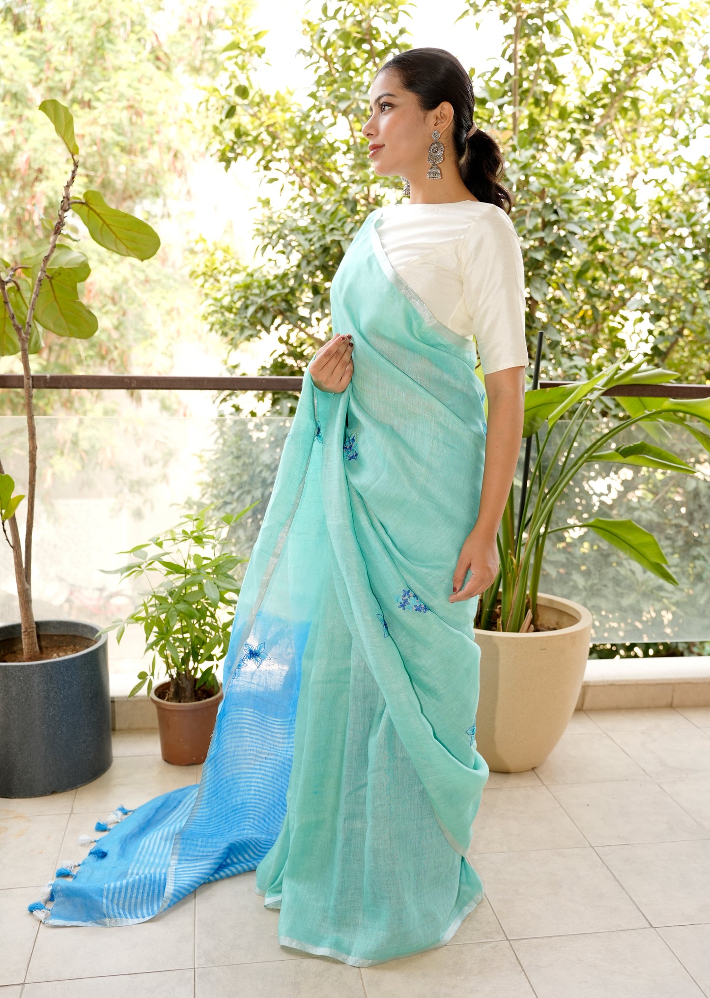 Aqua Blue Linen Saree with Hand Embroidered Floral Motifs