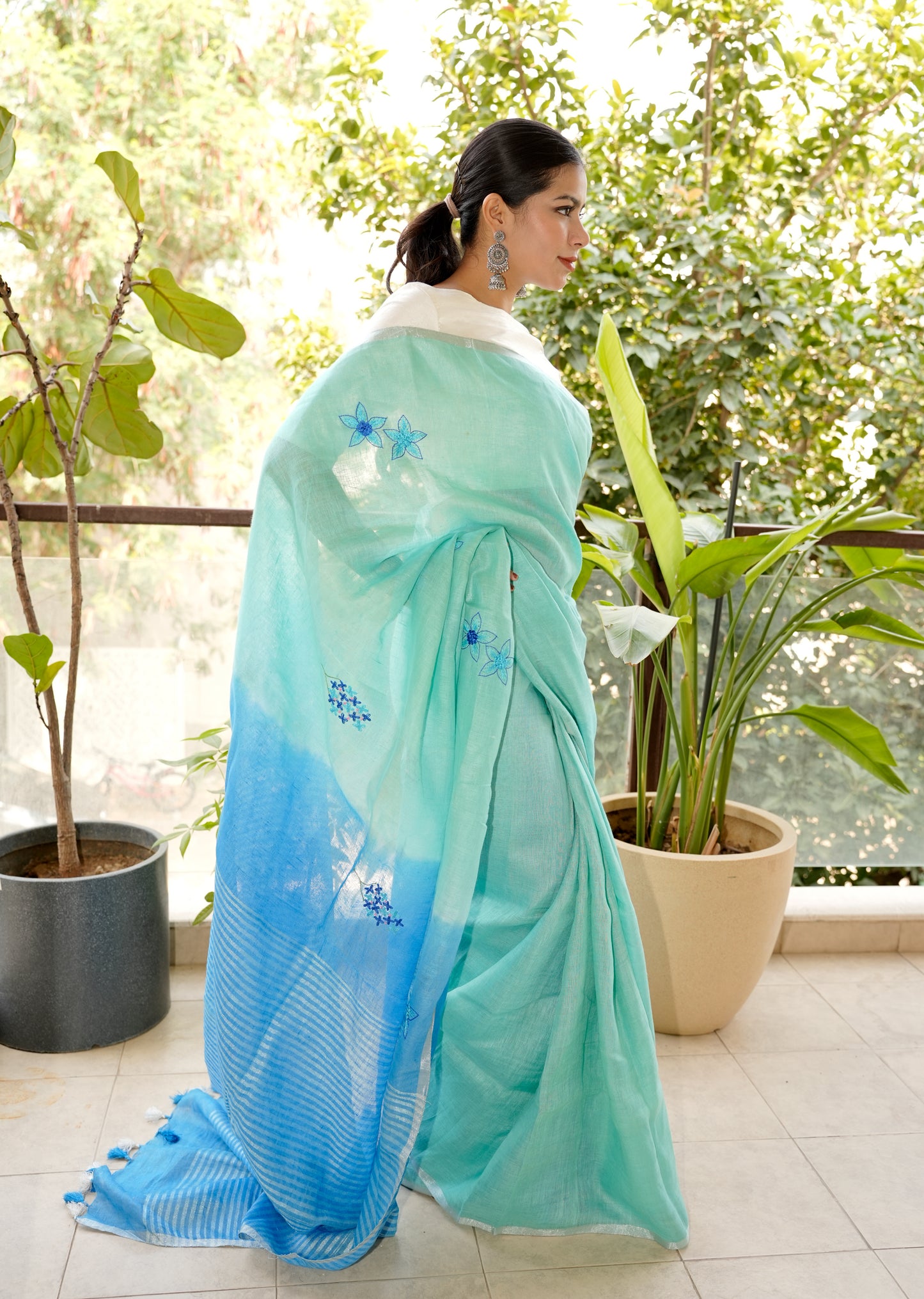 Aqua Blue Linen Saree with Hand Embroidered Floral Motifs