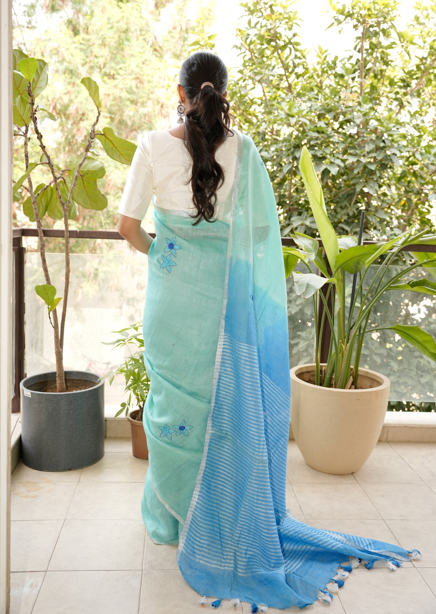 Aqua Blue Linen Saree with Hand Embroidered Floral Motifs