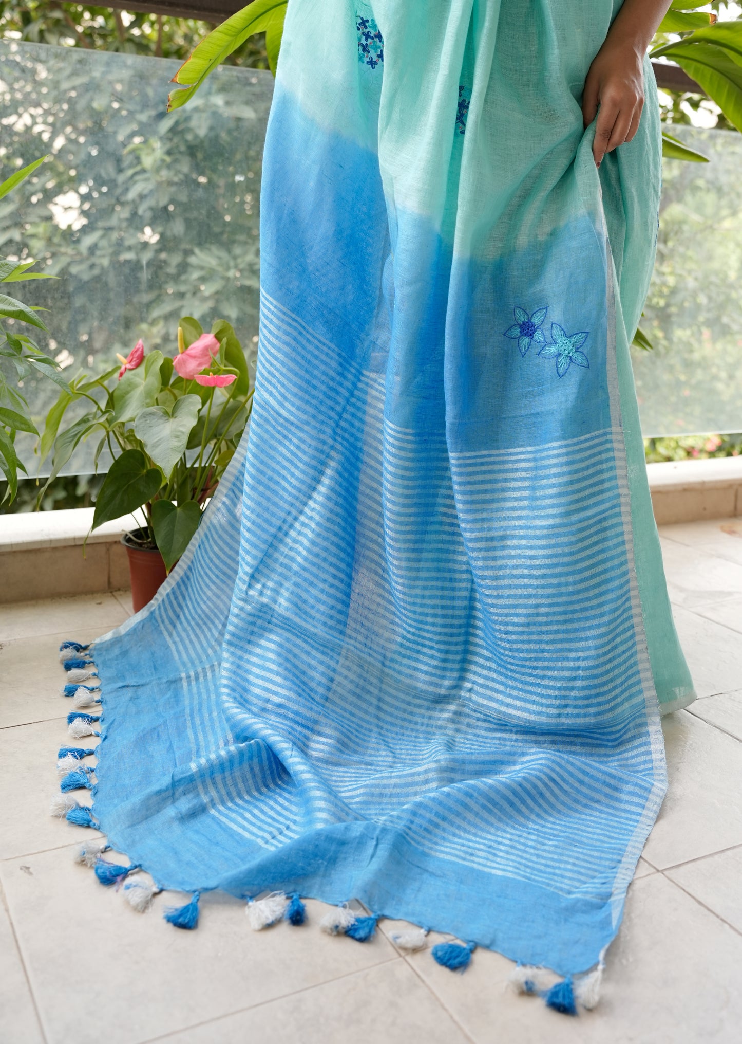 Aqua Blue Linen Saree with Hand Embroidered Floral Motifs