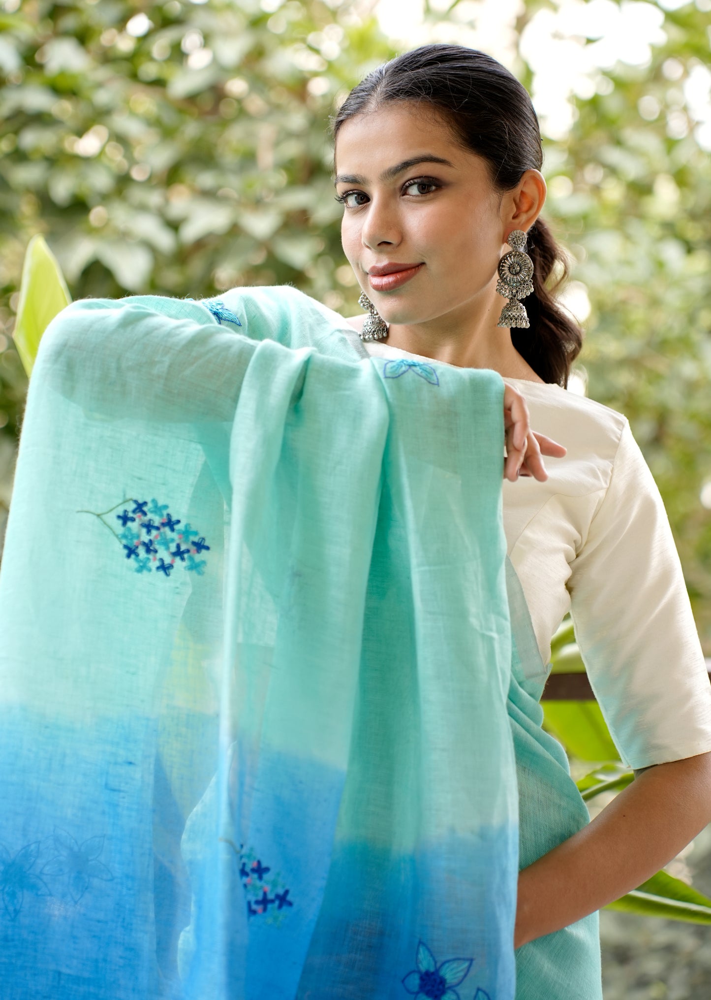 Aqua Blue Linen Saree with Hand Embroidered Floral Motifs